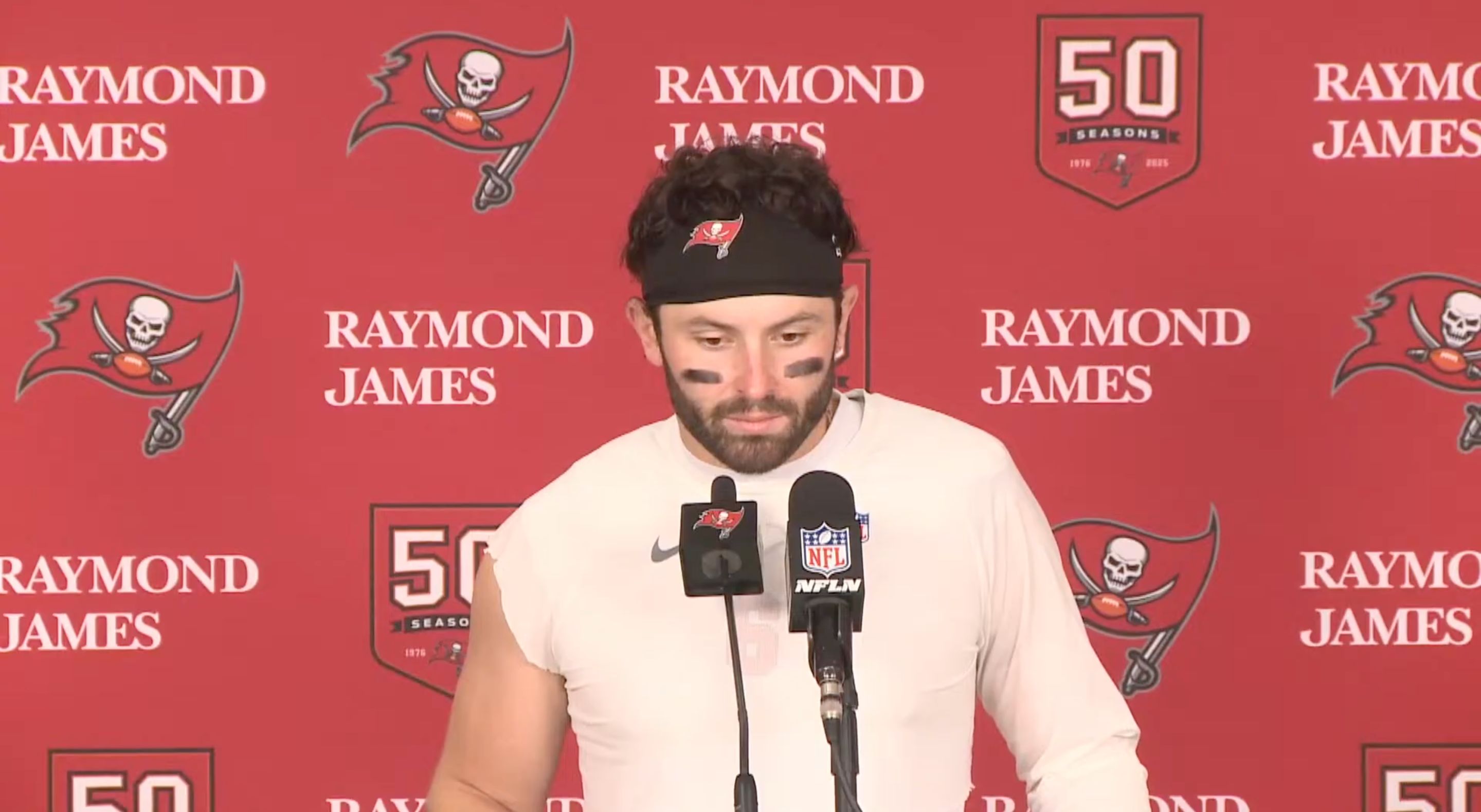 Baker Mayfield talks with reporters after the Bucs beat the Cardinals in Week 13.